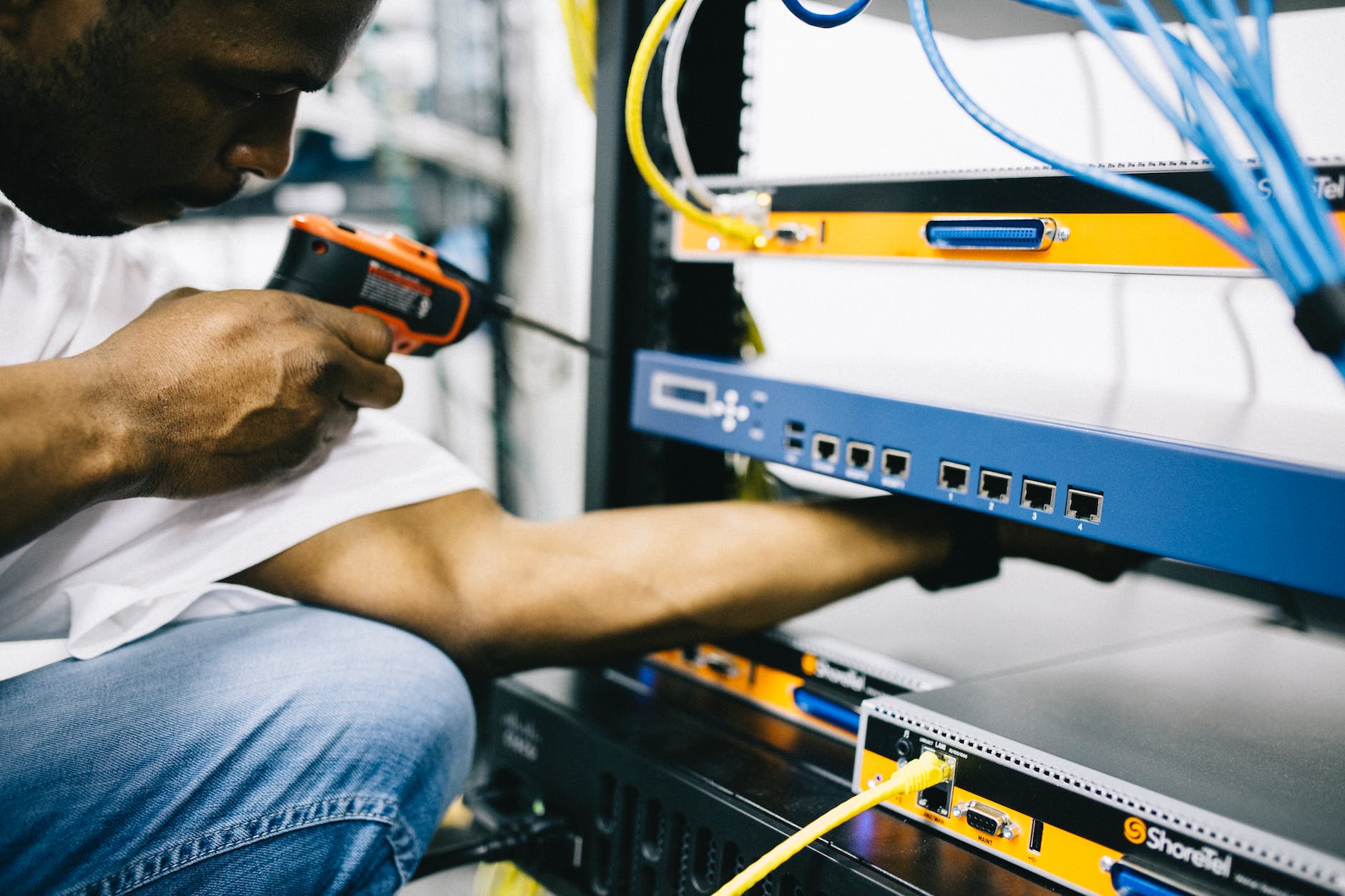 professional crop black technician working with hardware